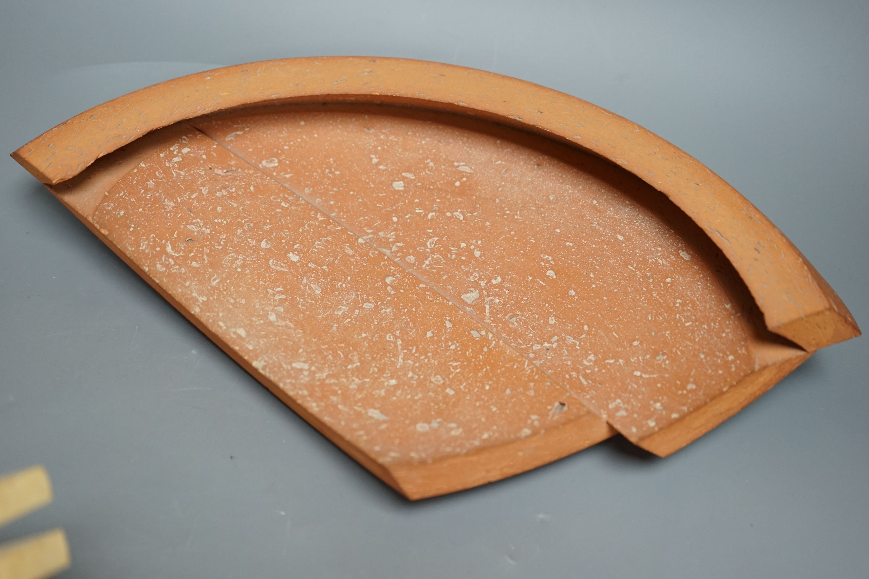 Martin Smith (b.1950), two disk forms, redware, one damaged, with original purchase receipt, largest 37cm wide (2)